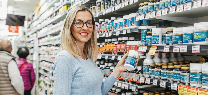 A Mr Vitamins naturopath talking with a customer in store